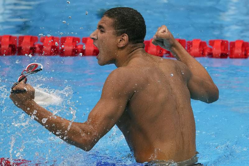 Tunisian teen wins surprise Olympic swimming gold