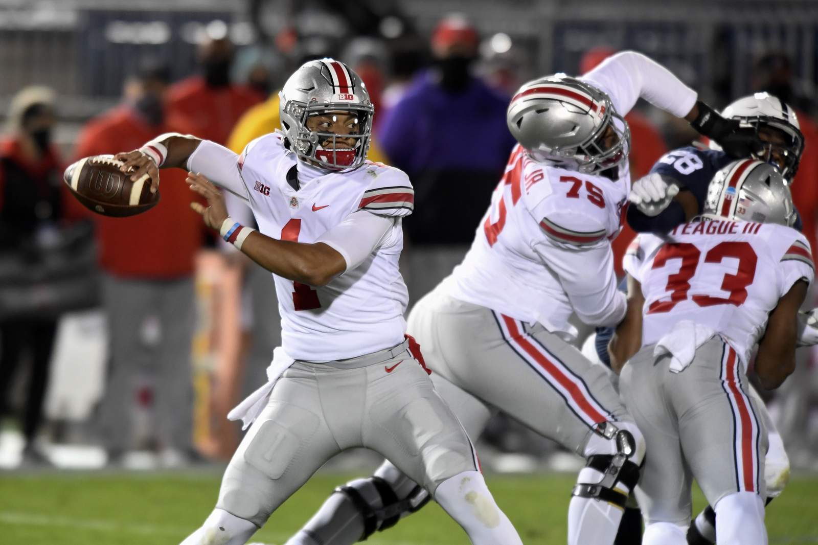 In empty white out, No. 3 Ohio State beats Penn State 38-25