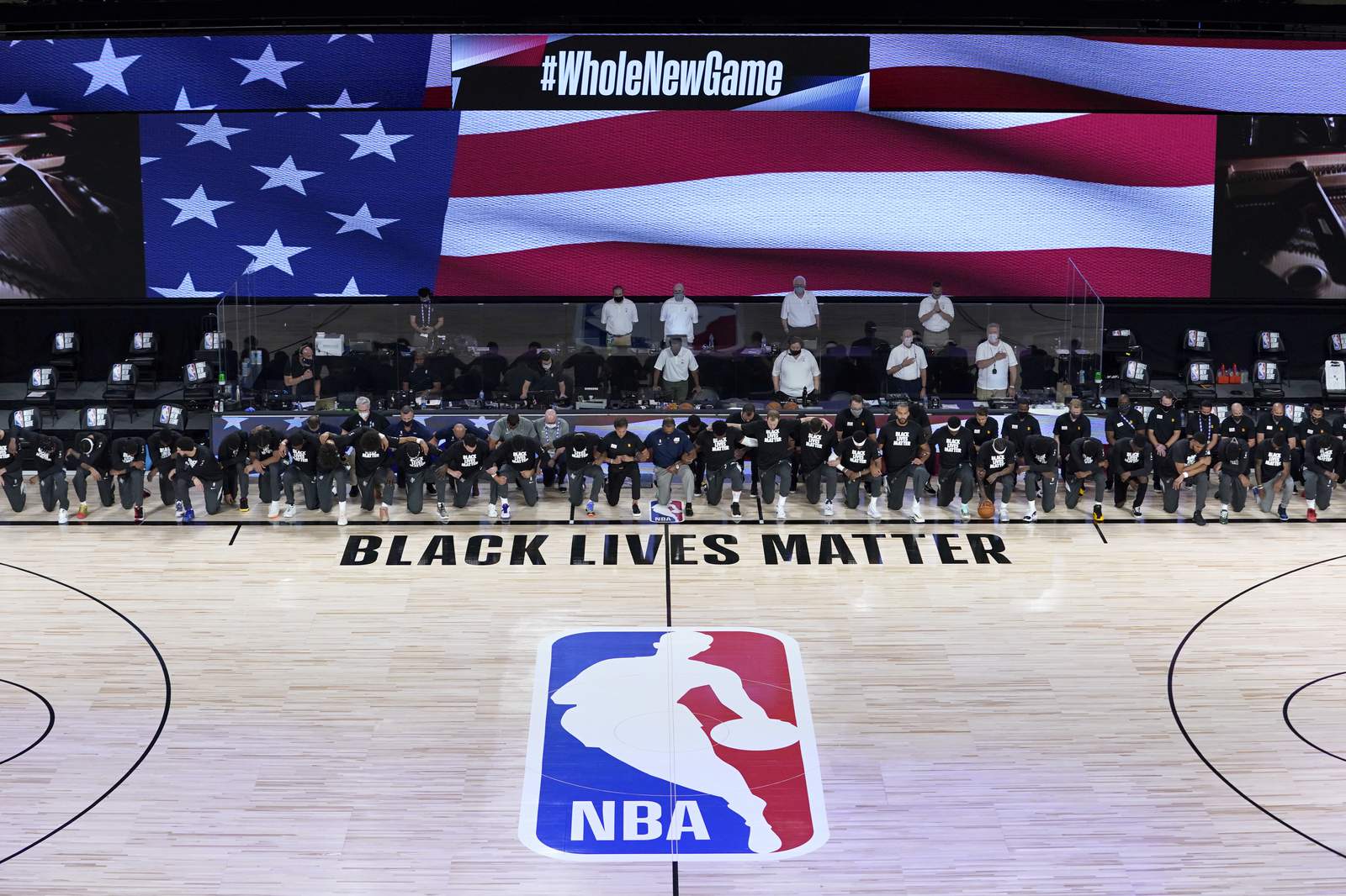 Players, coaches kneel before NBA's re-opening night