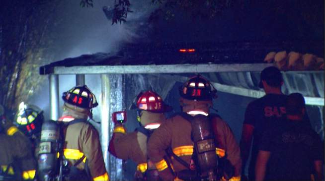 Late-night fire damages car, garage at Northeast Side home, fire officials say