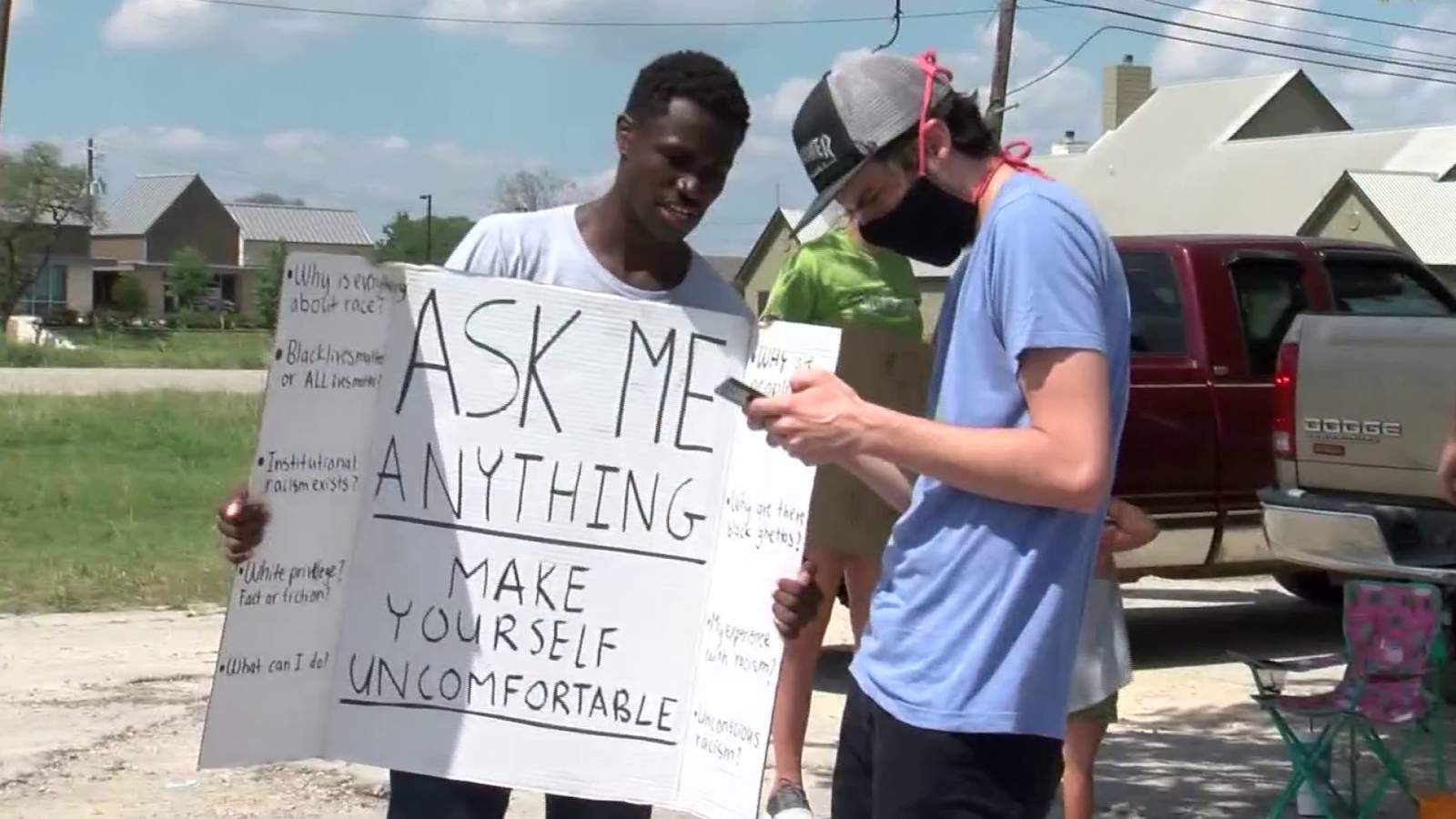 Texas man holds sign inviting his community to ask him anything about racism