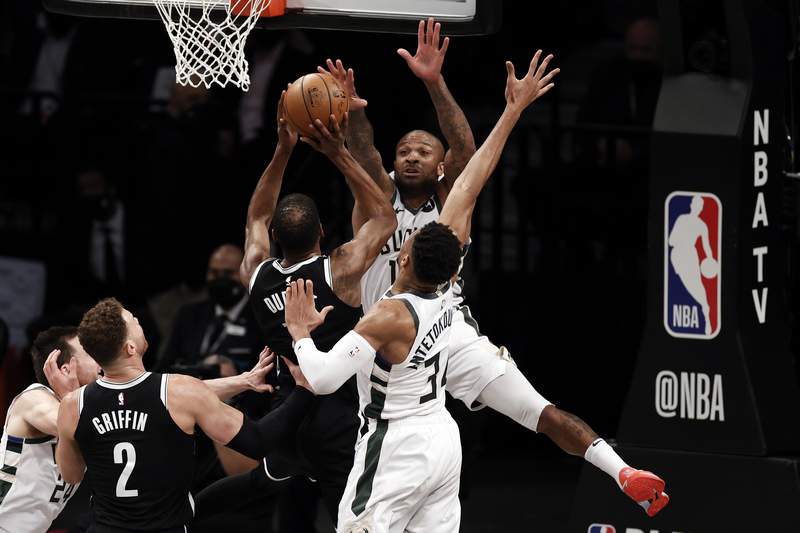 Durant, Irving carry Nets in opener after Harden hurt