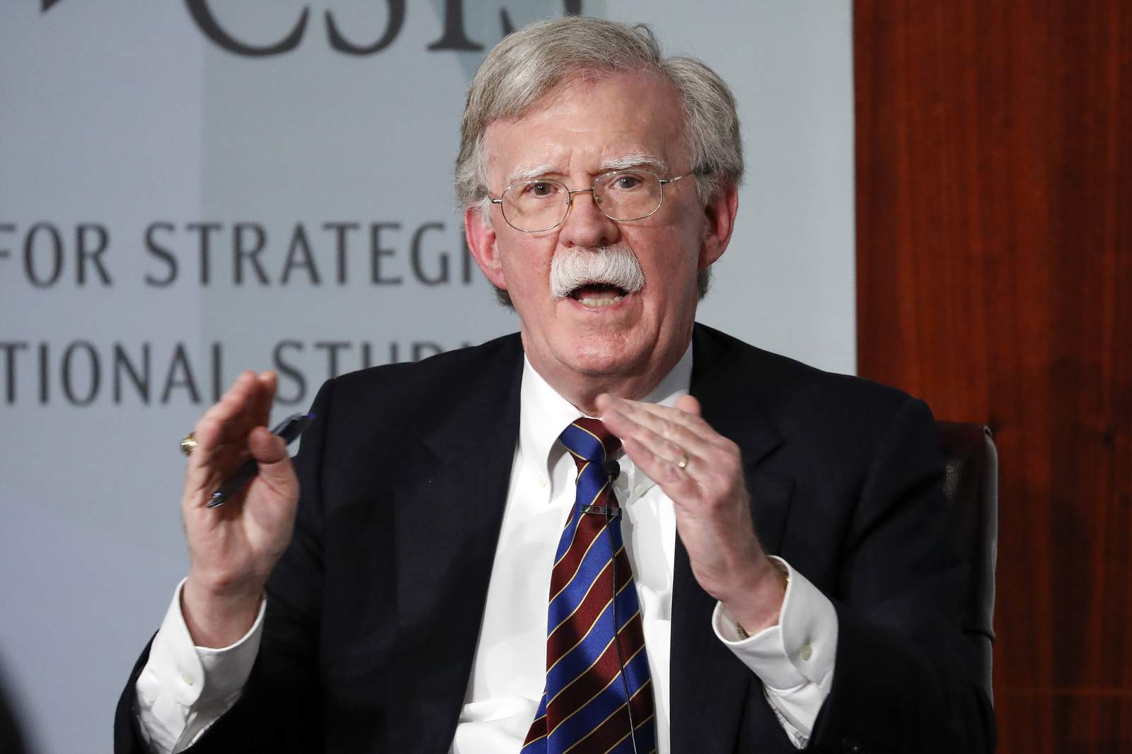 As Bolton speaks, Congress shrugs and points to election