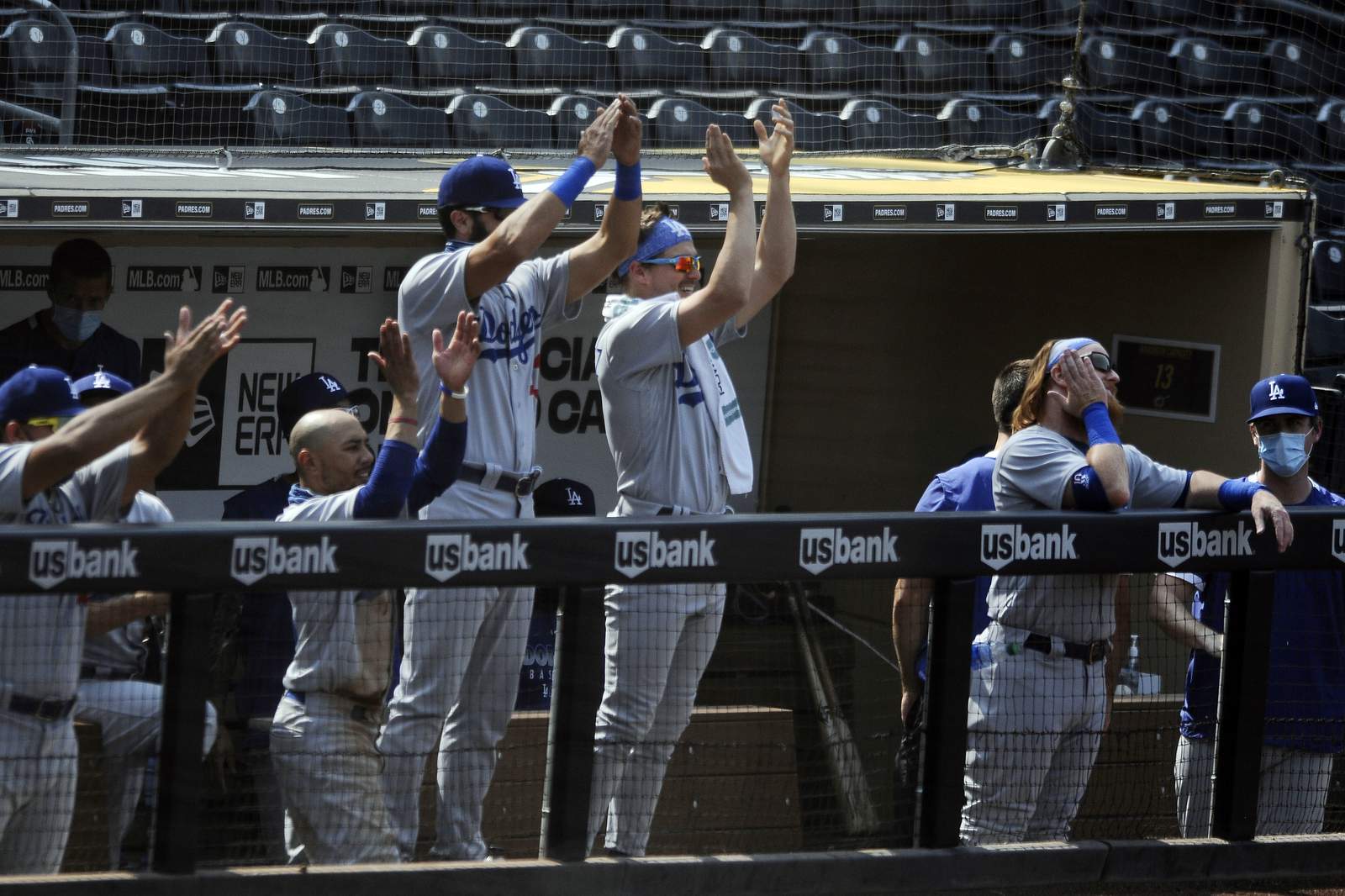 Dodgers 1st team to clinch playoff spot, beat Padres 7-5