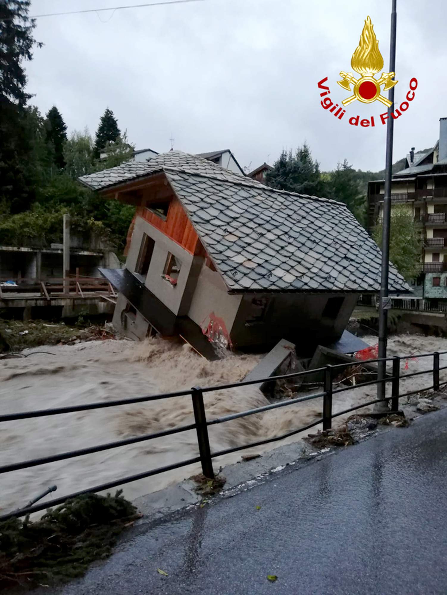 Mountain flooding kills 2 in Italy, traps dozens in France