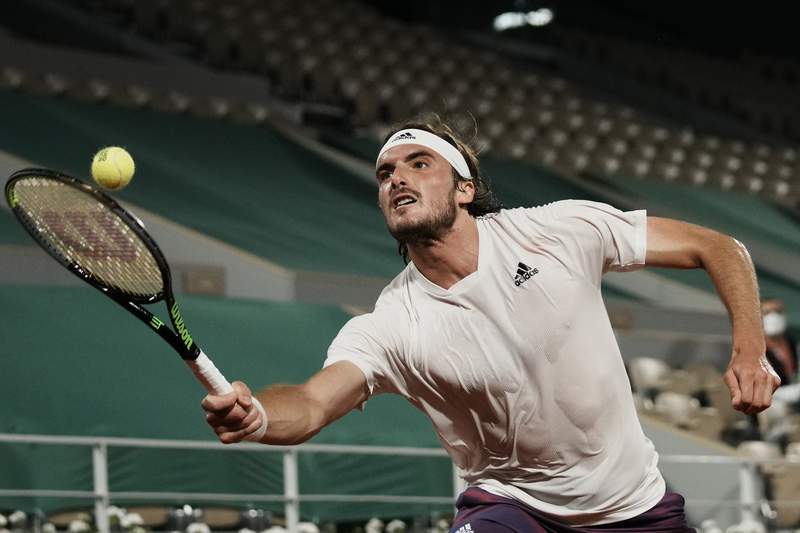 The Latest: Tsitsipas beats Medvedev to reach French Open SF