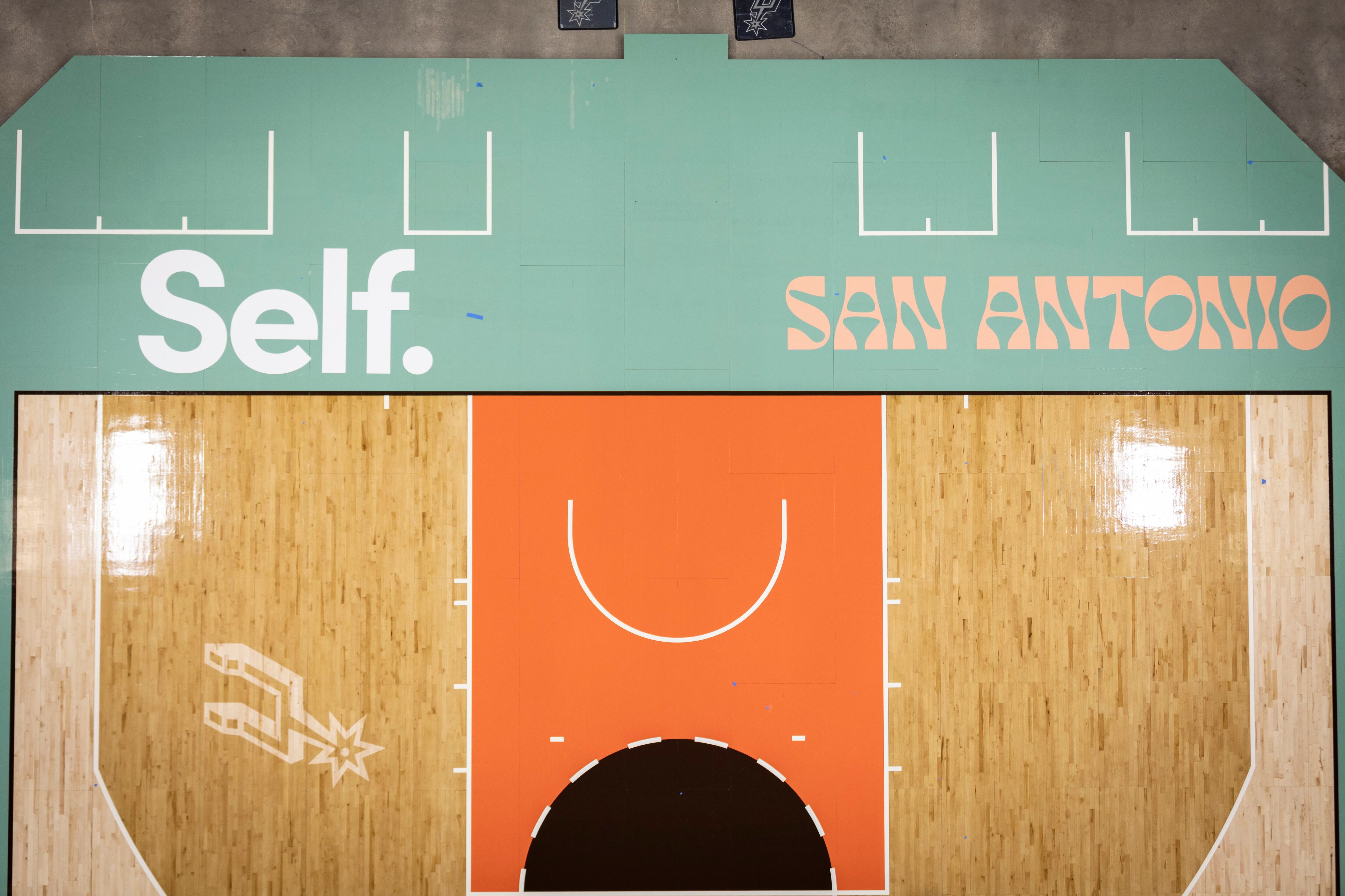 Installation of the San Antonio Spurs 2023-24 City Edition Court in San Antonio, Texas.
(Photo by Rance Ristau/San Antonio Spurs)