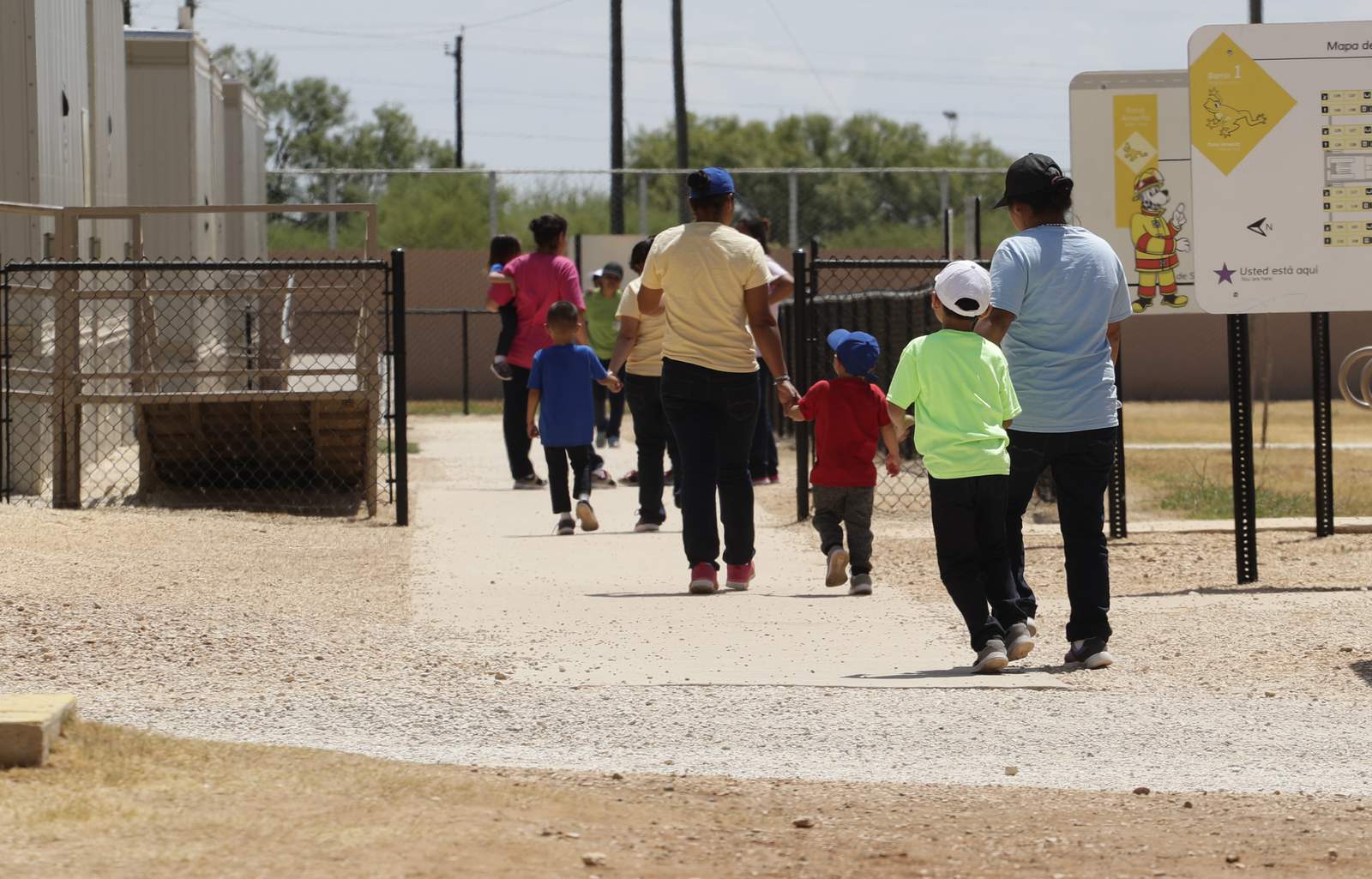 Detained in isolation, migrant families fear catching virus