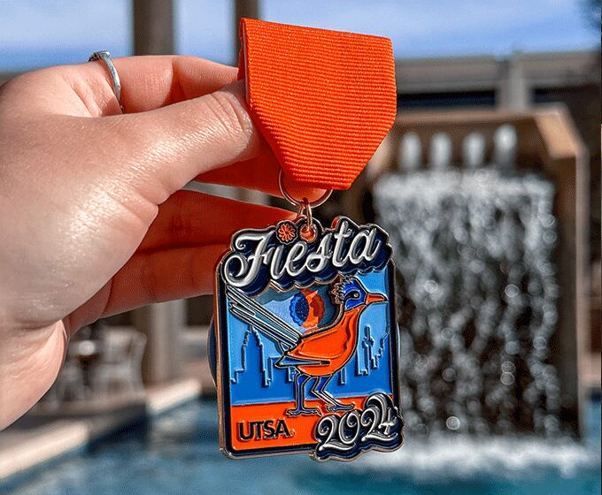USTA's Fiesta medal design celebrates the April 8 total solar eclipse.