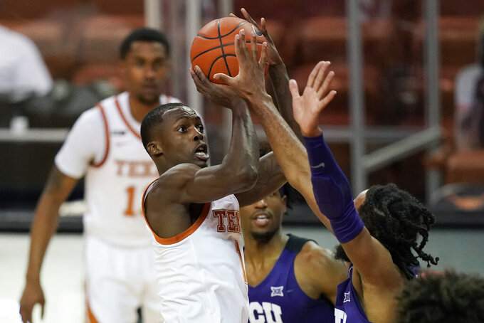 No. 15 Texas keeps road roll going with 76-64 win over TCU