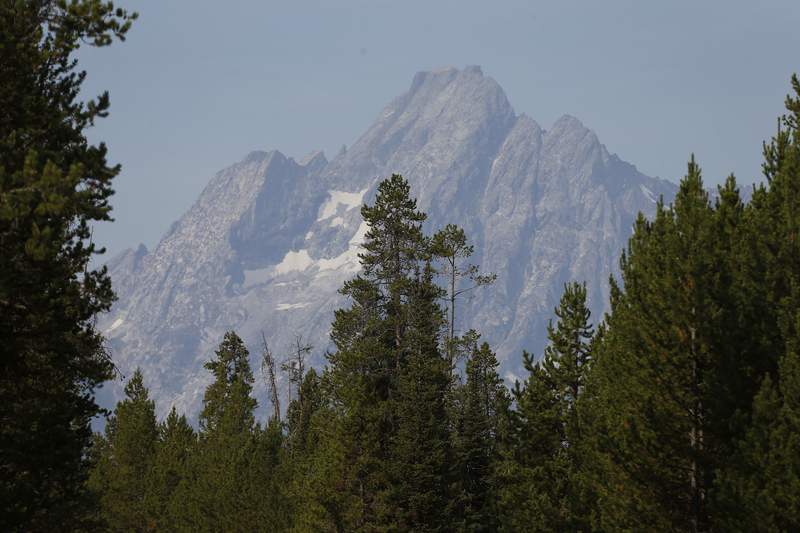 The greeting  prima   illuminates the Grand Tetons, successful  Grand Teton National Park, Wyo., Saturday, Aug 27, 2016. Park activities proceed  contempt  wildfires conscionable  northbound  of Coulter Bay and successful  Yellowstone which person  closed Teton's northbound  entranceway  and the southbound  entranceway  to Yellowstone National Park. (AP Photo/Brennan Linsley)