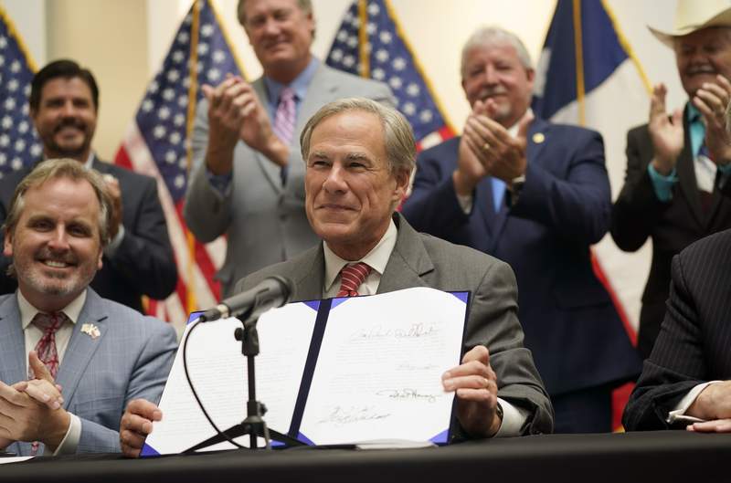 Texas governor signs new GOP voting restrictions into law