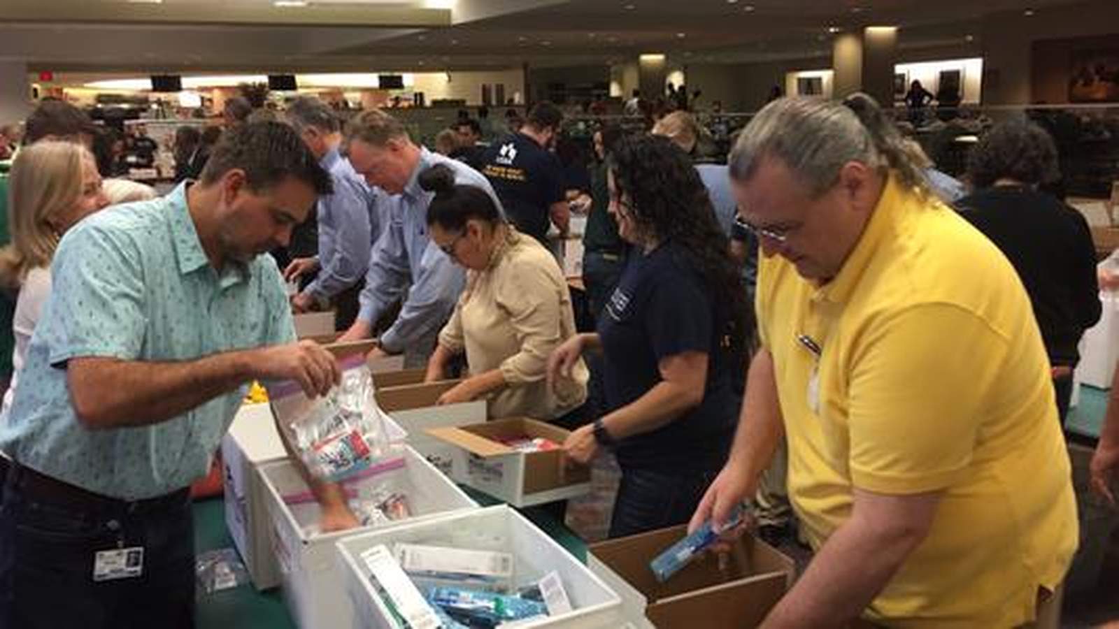 USAA employees help assemble care packages for deployed servicemen and women