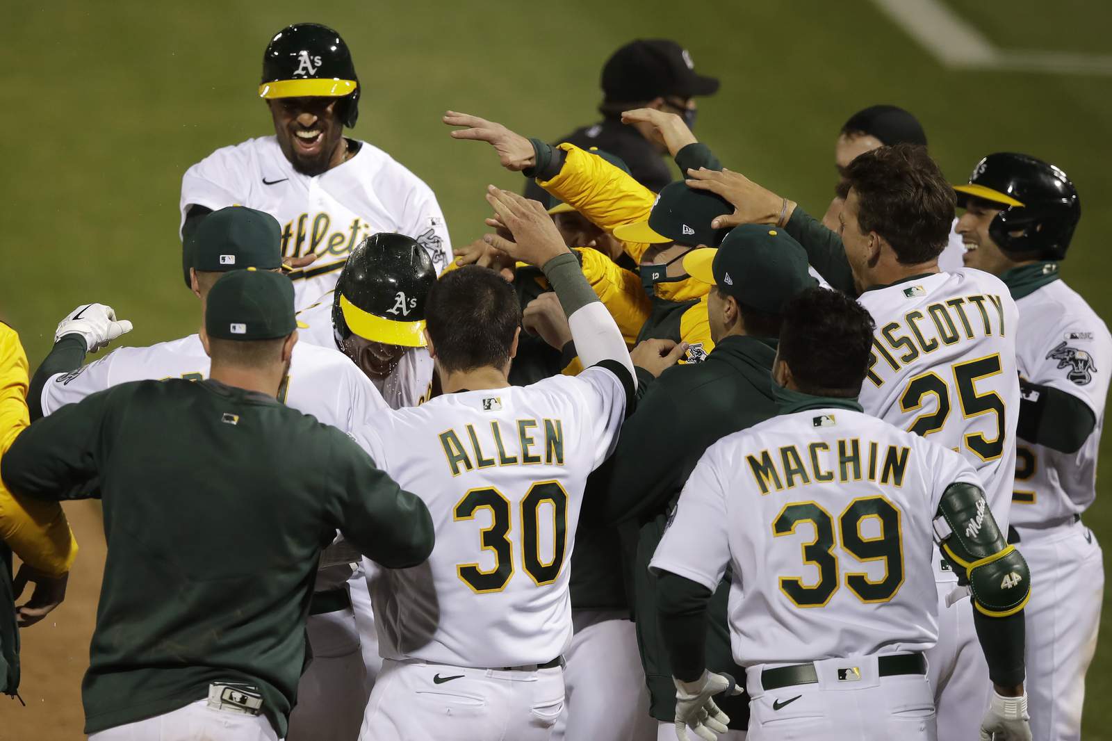 In 1st MLB game with new extra-inning rule, A's slam Angels